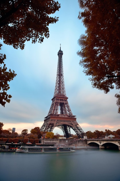 Eiffel Tower with bridge in River Seine in Paris, France.