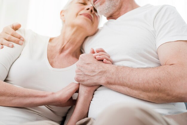 Elder couple being affectionate with each other