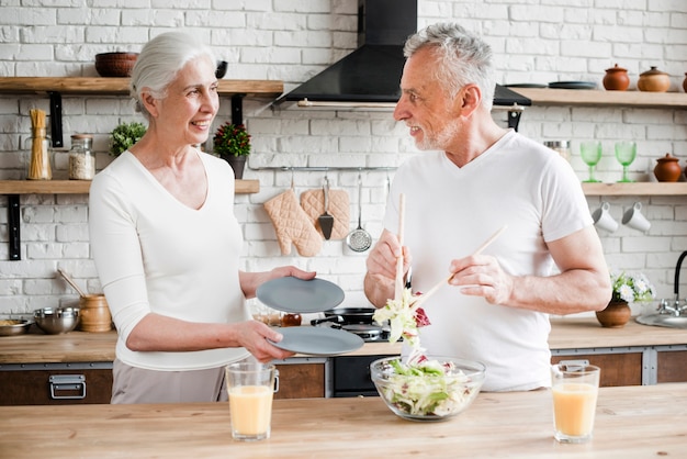 Elder couple cooking in the kitchen