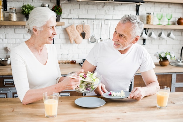 Elder couple cooking in the kitchen