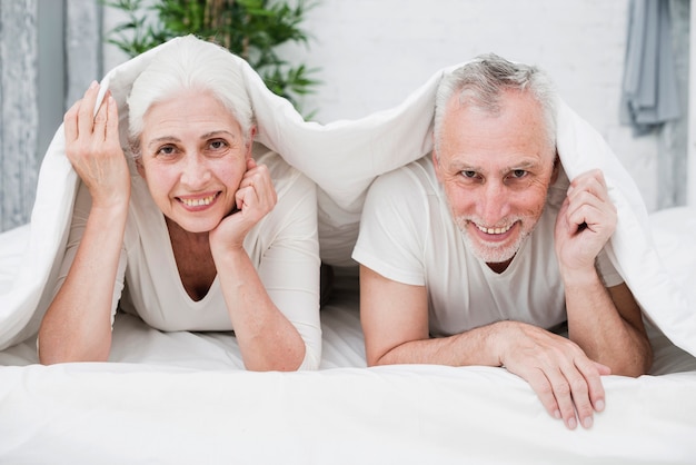 Elder couple posing for a photo