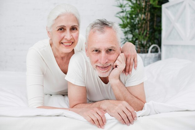 Elder couple posing for a photo