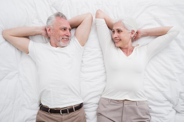 Elder couple posing for a photo