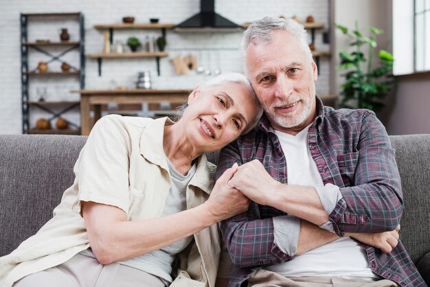 Elder couple posing for a photo