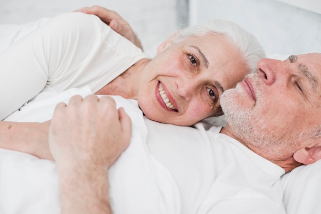 Elder couple resting in the bed