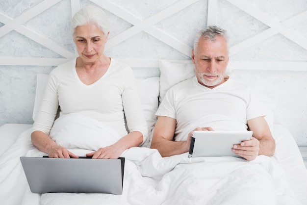 Elder couple using a laptop