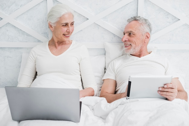 Elder couple using a laptop