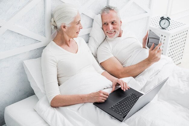 Elder couple using a laptop