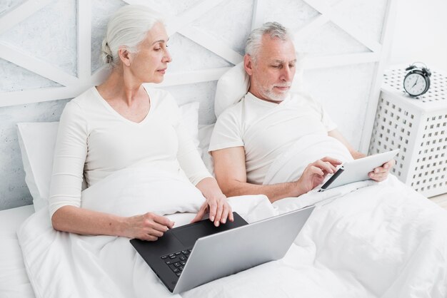 Elder couple using a laptop