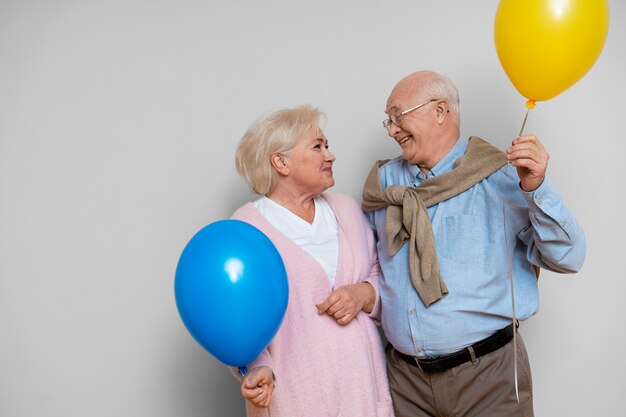 Elder friends partying together front view