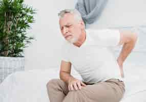 Free photo elder man with back pain