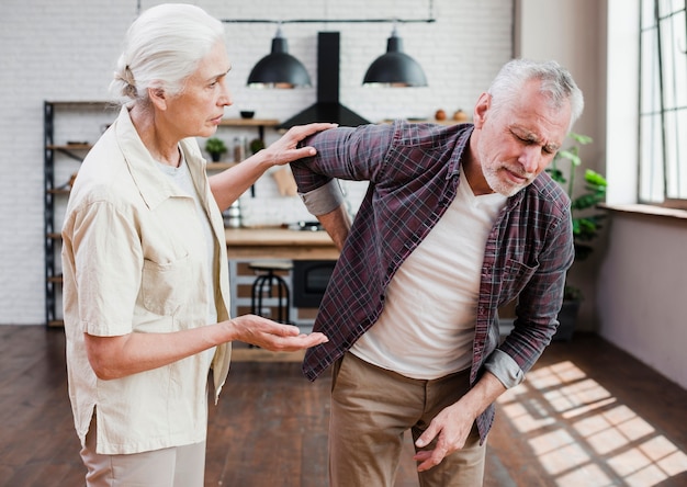 Free photo elder man with back pain