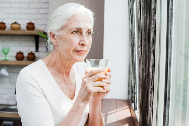 Elder woman having a juice