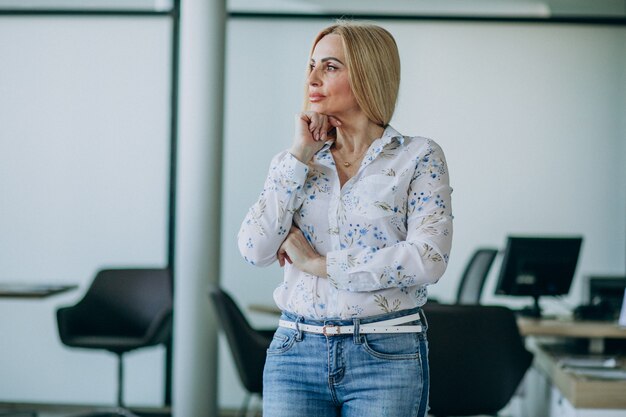 Elderly business woman in office isolated