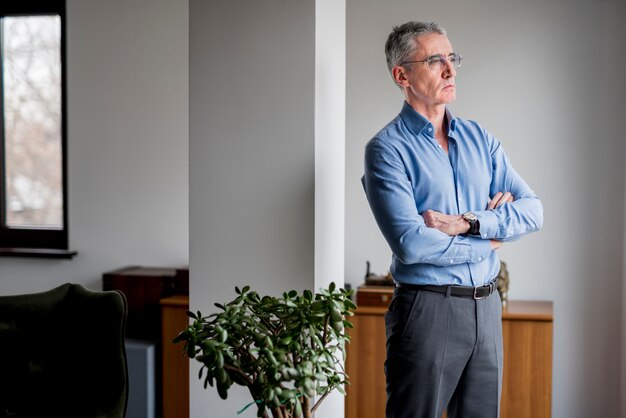 Elderly businessman posing