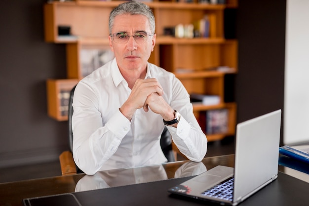 Elderly businessman posing