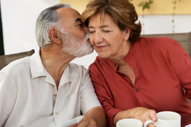 Elderly couple enjoying life at home in the countryside