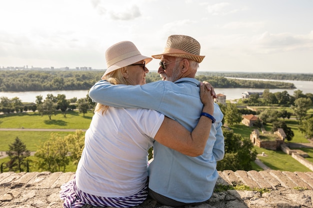 Elderly couple hugging each other