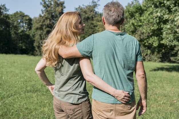 Elderly couple hugging each other