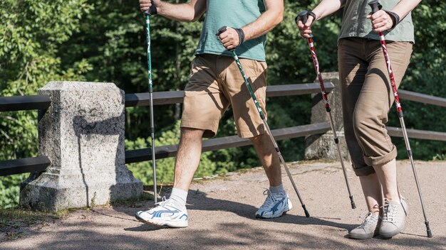 Elderly couple using trekking poles