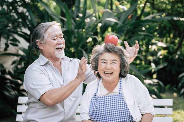 Free photo elderly couples cooking healthy food together