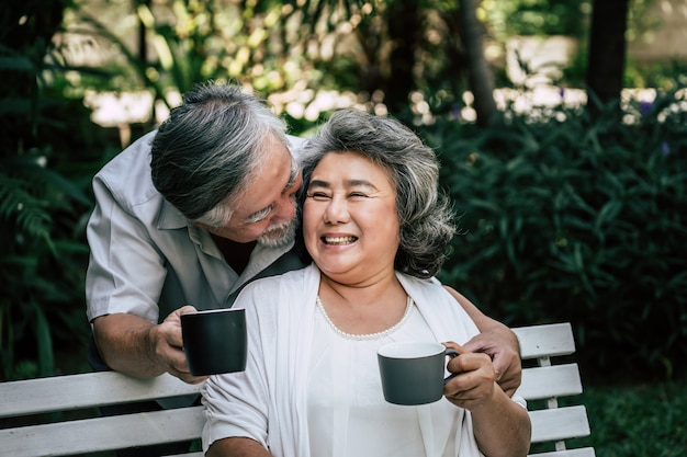 Free photo elderly couples playing and eating some fruit