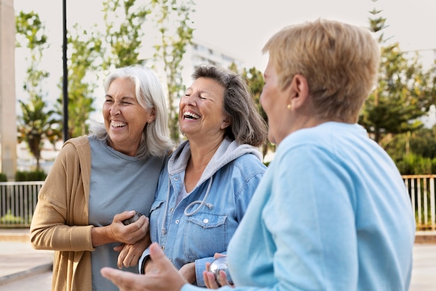 Elderly friends playing petanque