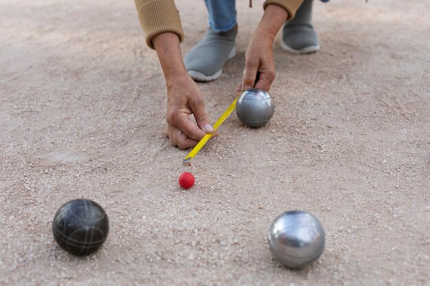 Elderly friends playing petanque