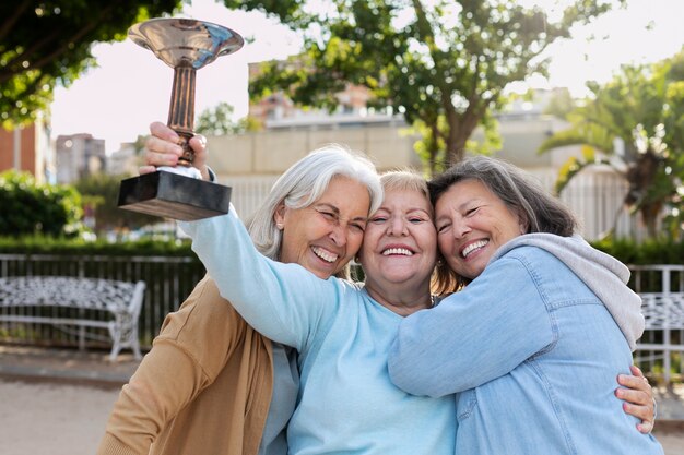 Elderly friends playing petanque