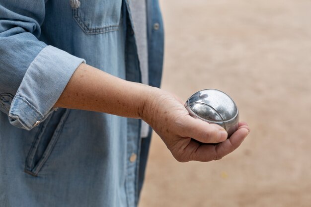 Elderly friends playing petanque