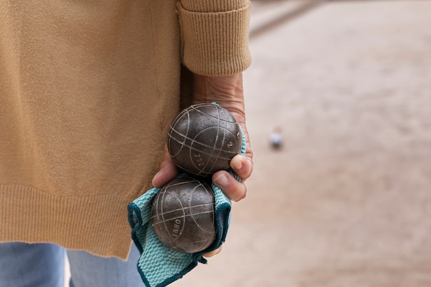 Elderly friends playing petanque