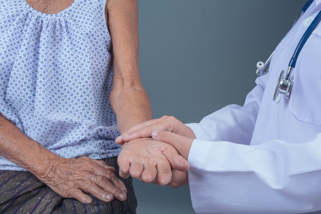 Elderly health check with young nurse.