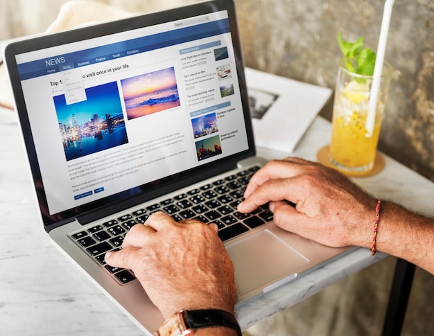 Elderly man is using computer laptop