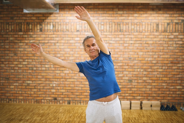 Free photo elderly man stretching