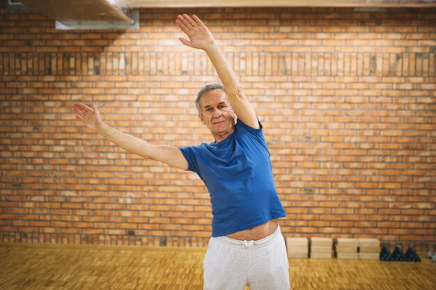 Elderly man stretching