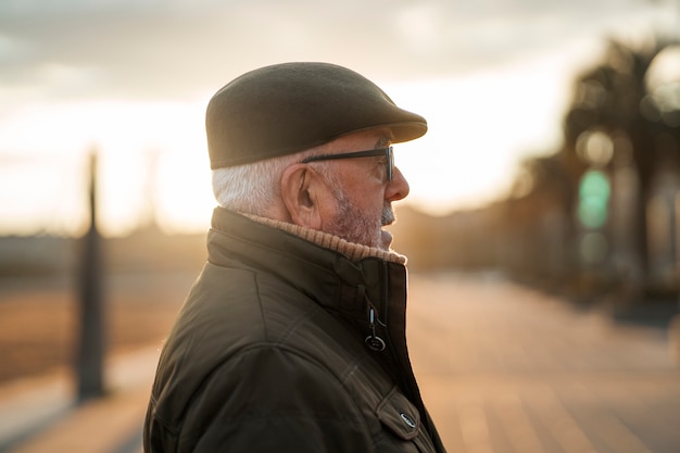 Free photo elderly man taking a stroll