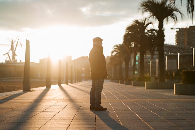 Free photo elderly man taking a stroll