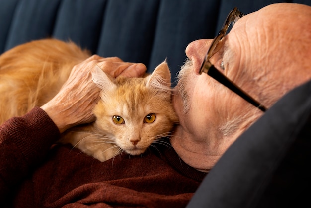 Free photo elderly person with pet cat