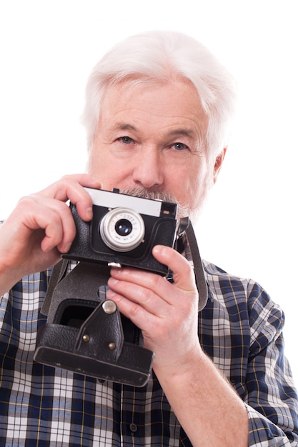 Elderly photographer with retro camera