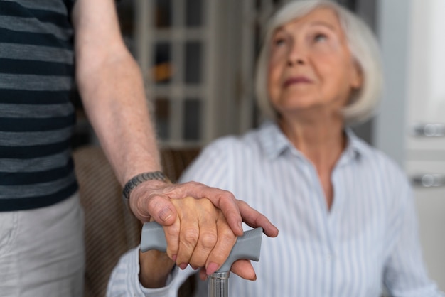 Elderly woman looking at her caregiver