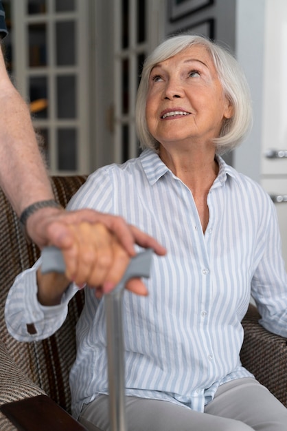 Elderly woman looking at her caregiver