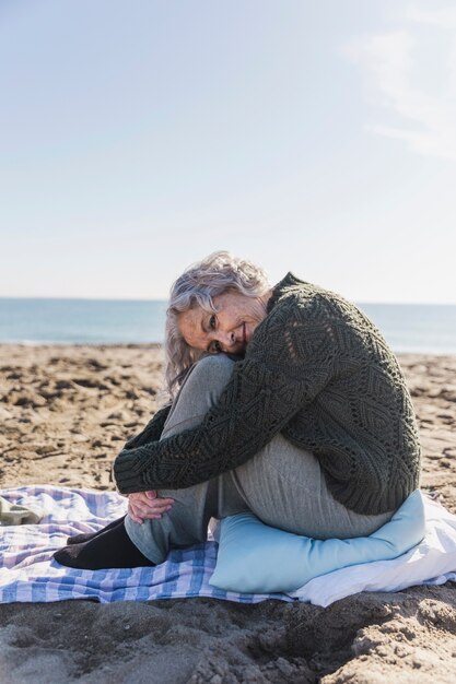 Elderly woman posing outdoors