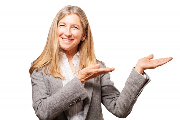 Elderly woman raising her hands to one side