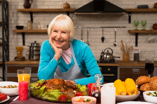 Elderly woman smiling and looking at the camera