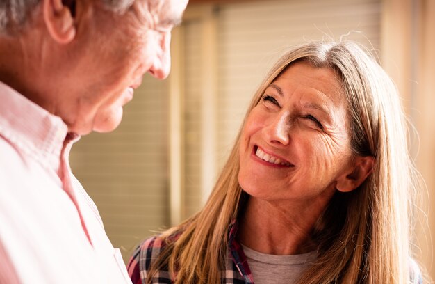 Elderly woman smiling older man