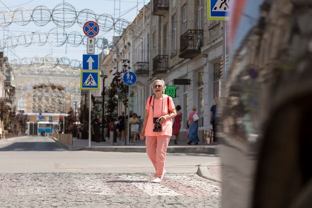 Elderly woman traveling alone in the summer