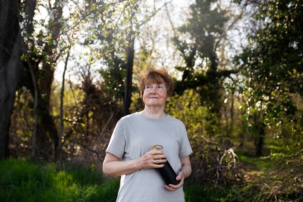 Elderly woman walking in park