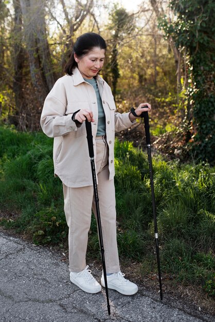 Elderly woman walking in park