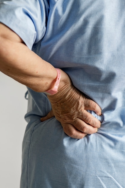 Free photo elderly woman with back pain