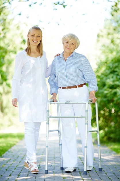 Elderly woman with walking frame